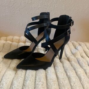 Heels size 8 zip up back cris crossed front. Nwot black